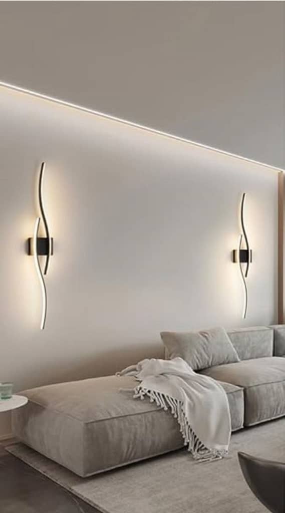 Long LED wall sconces on a living room wall, giving it a luxurious look