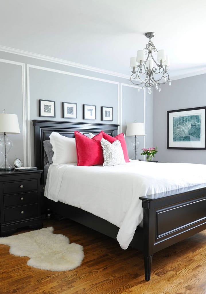 Small bedroom with light gray bedroom walls, making the room feel bigger