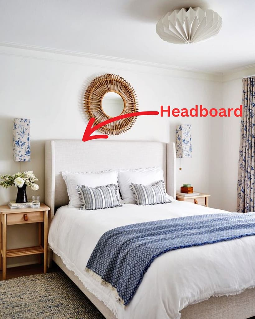 Image of a bed in a bedroom and a red arrow pointing to the bed's headboard