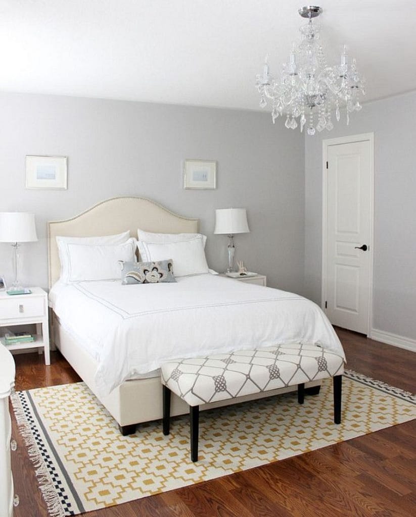 Light gray walls as a base color for farmhouse bedroom wall decor