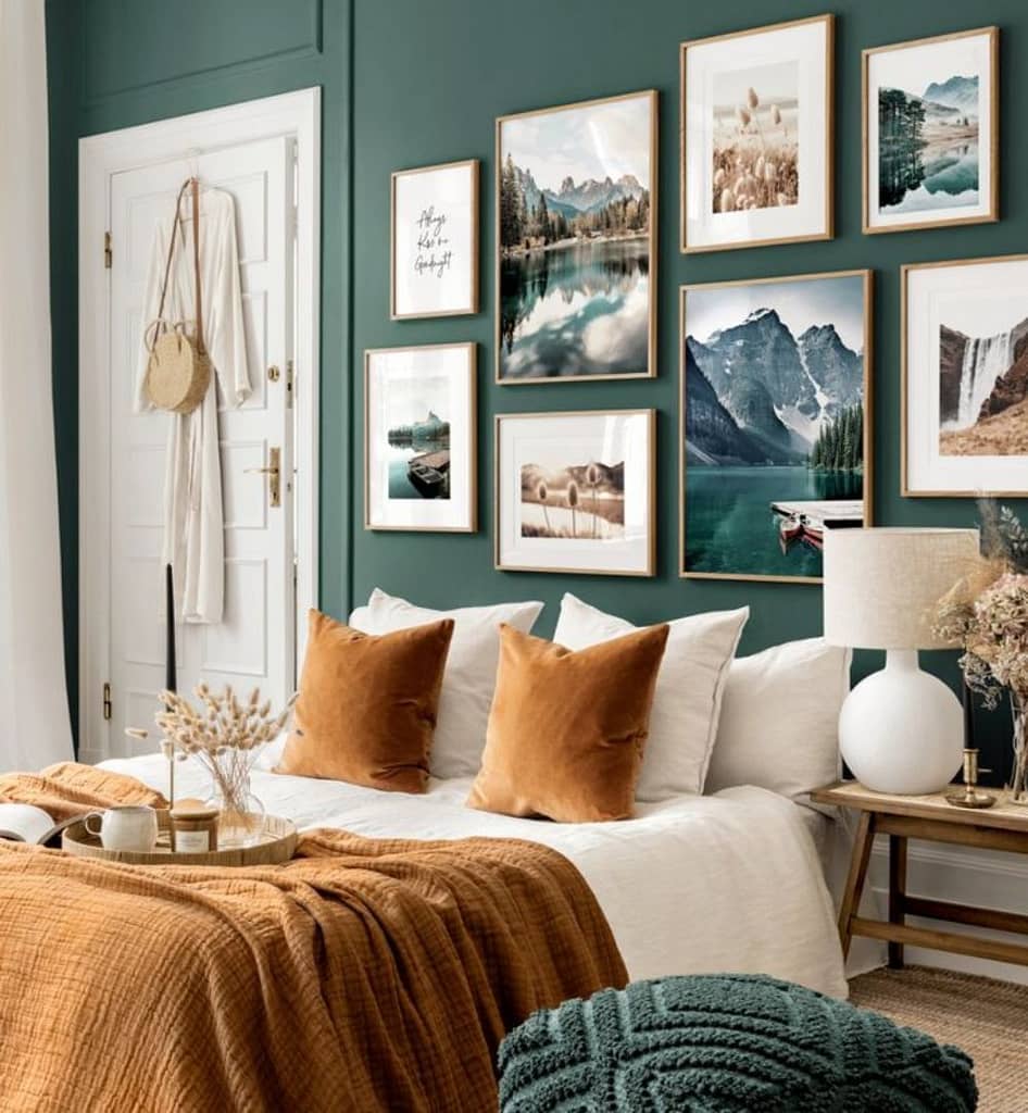 Minimalistic nature themed gallery wall in a bedroom with dark green walls