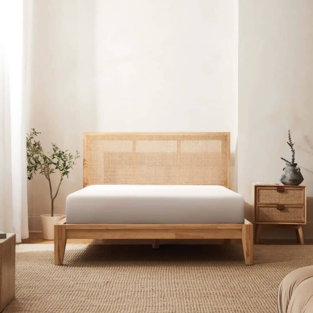 Wooden bed frame made of rubber wood in a bedroom with a minimalistic design