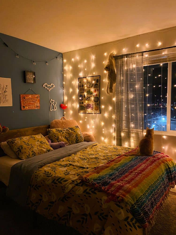 Dim cozy bedroom lighting from string lights on the wall