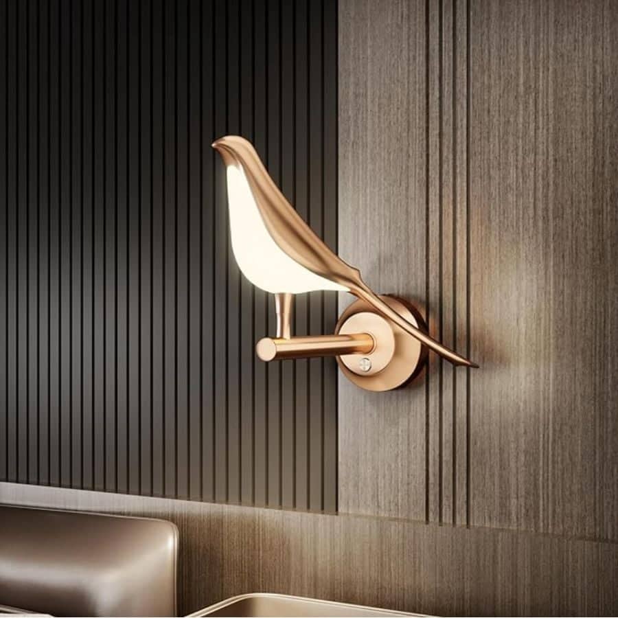 Product image of rose gold bedside bird wall sconce