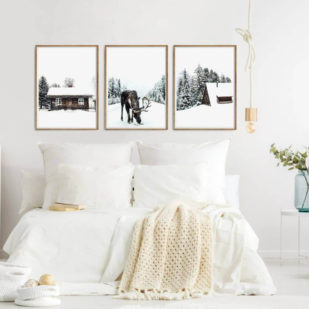 Winter themed farmhouse bedroom wall art hanging above bed