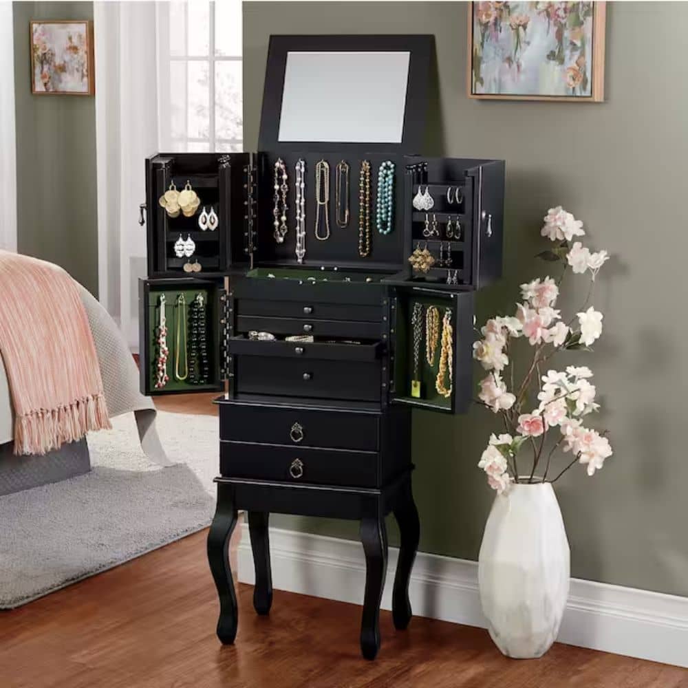 One of the different types of bedroom furniture for storing jewelry is this black jewelry armoire