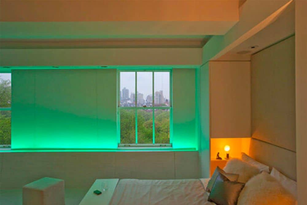 Green LED strips in a window sill, making it glow